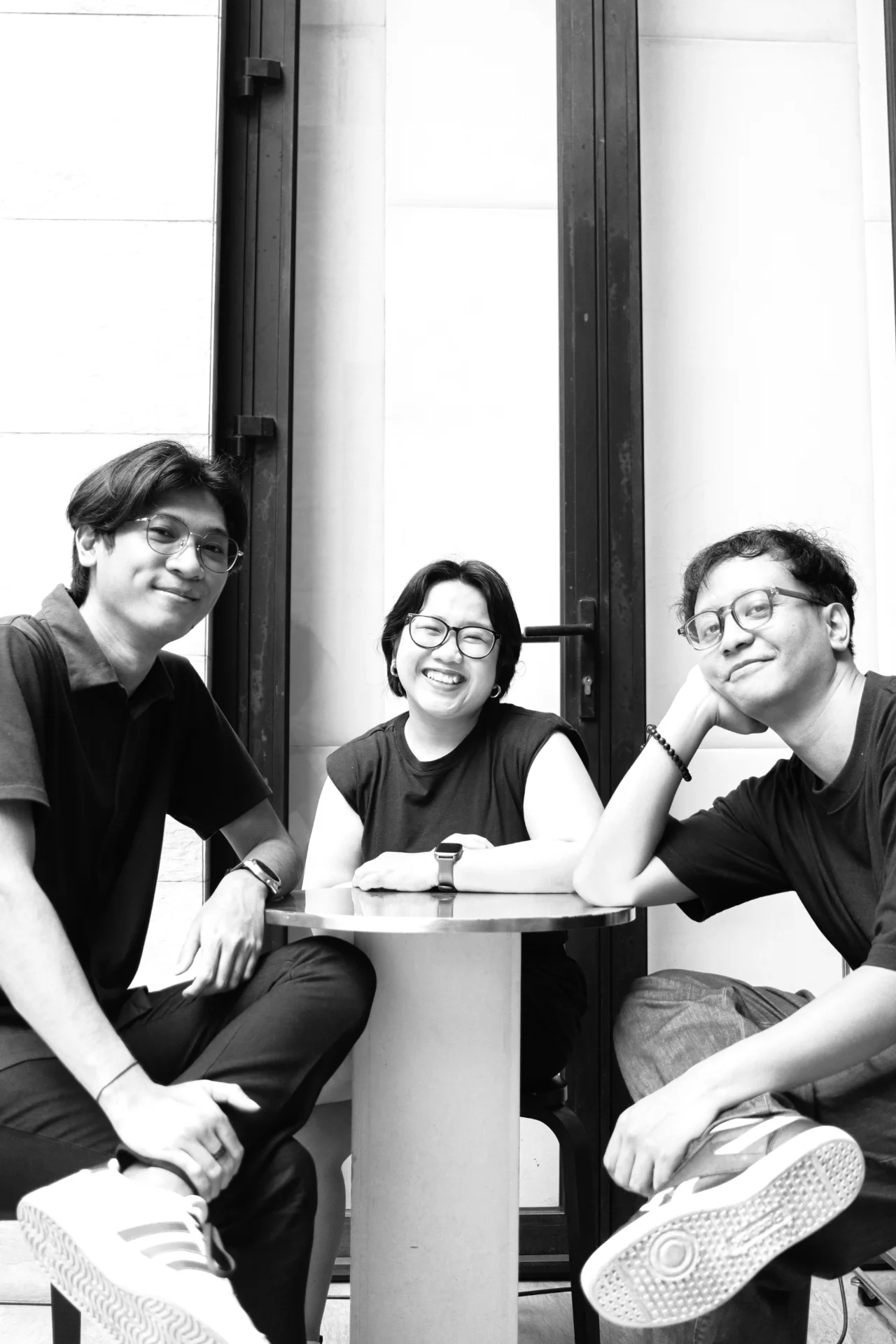 Marshall, Ruthyana and Sindhu of Terza seated around a café table